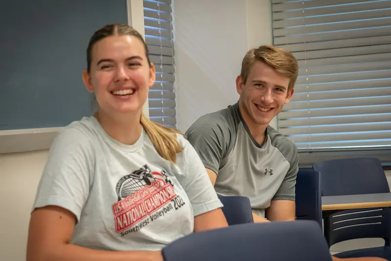 Two Marietta College students smile during orientation.