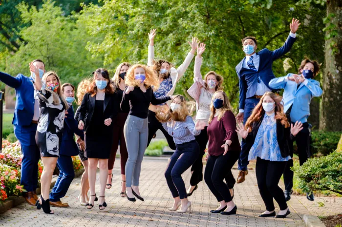 Group of students jumping up and celebrating