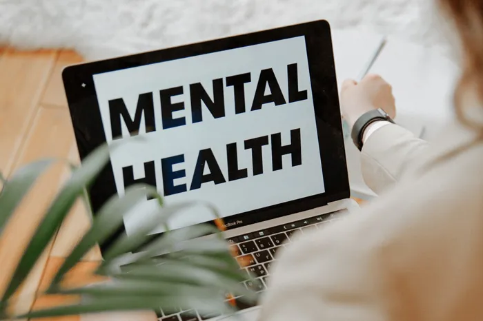 Screen with graphic which reads "Mental Health"