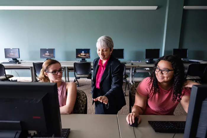 Grace Johnson speaking with students