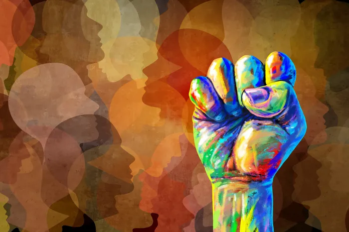 Illustration of a multicolor fist raised in the air with faces in the background