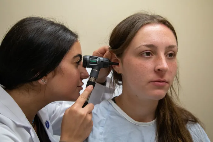 PA student examing a patient