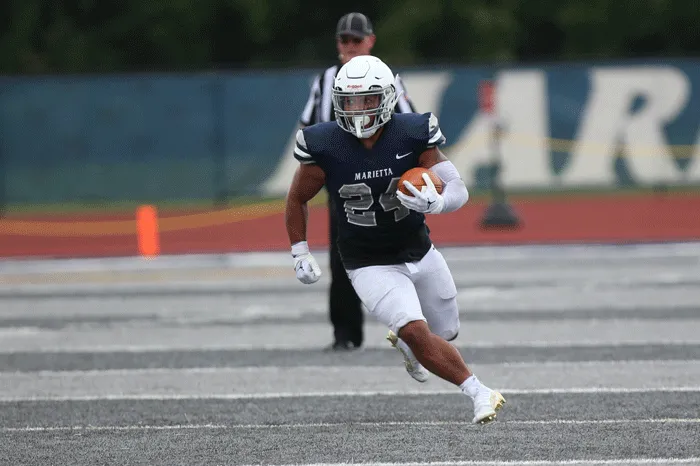 Bryce Agnew running up field at Don Drumm Stadium