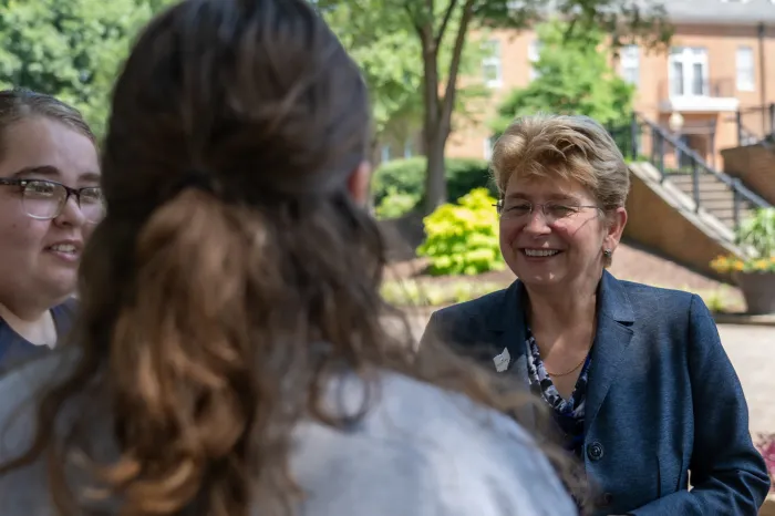 President Drugovich speaking with students