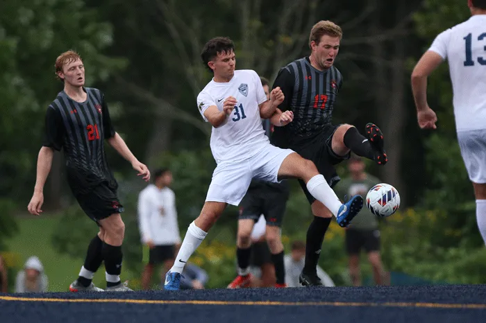 Soccer player battling for possession of the ball