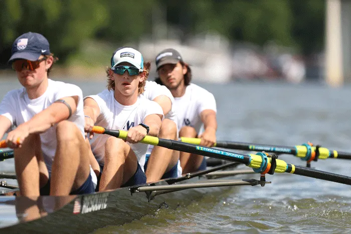 Male rowers working hard