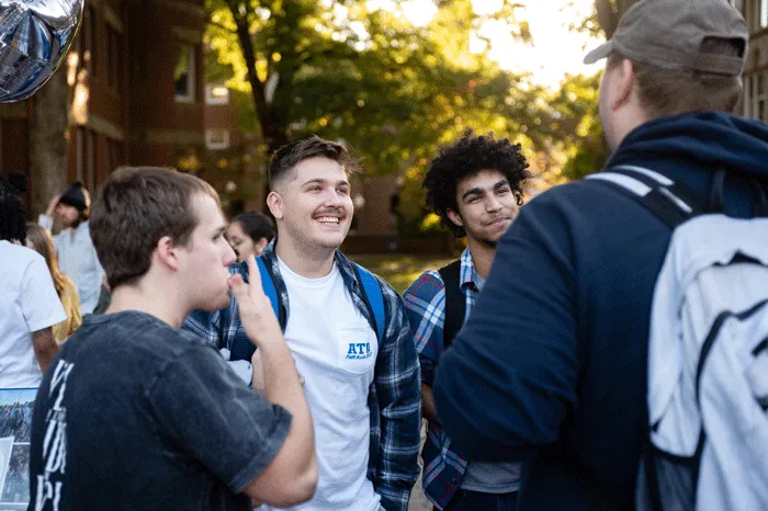 Male students smiling