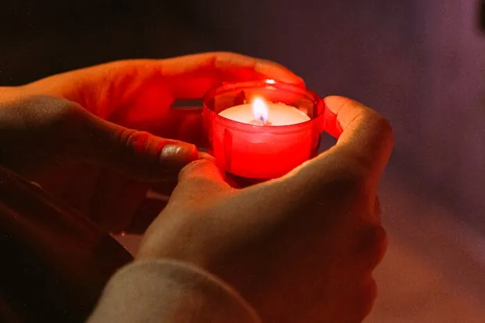 Person holding a candle