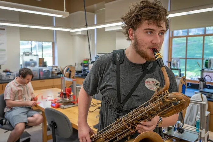 Kellen Franks ’27 plays a baritone saxophone as part of 2024 All Scholars Day