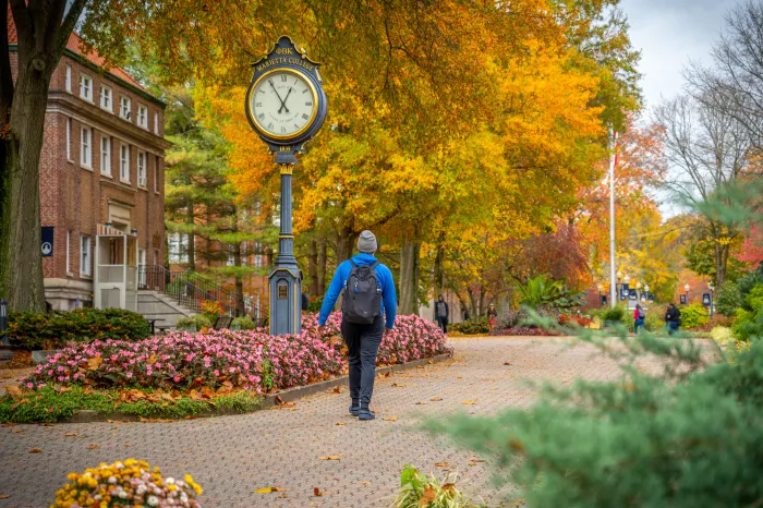 Student walking on Marietta College's Mall