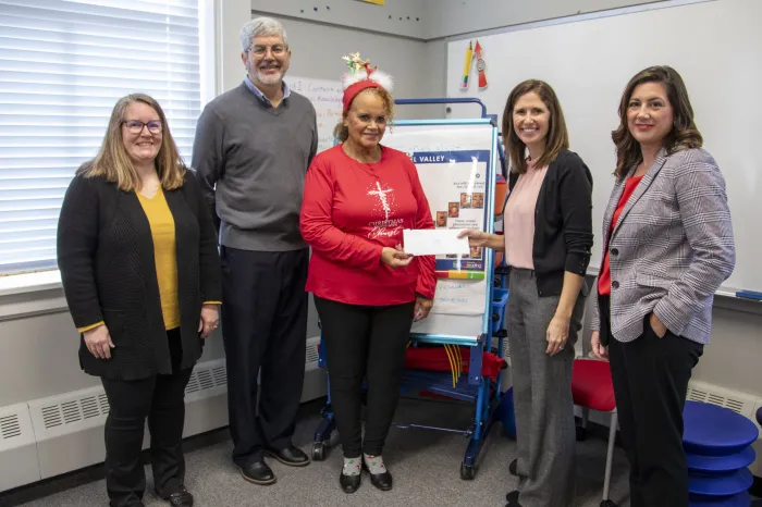 Cynthia Brown, Fred Rader, Emily Buck, Amanda Rider and Amy Nahley during a Parkersburg Community Foundation Grant check passing ceremony