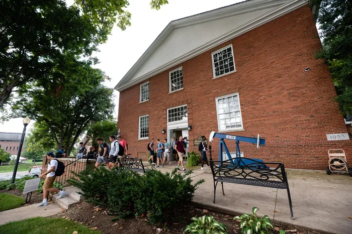 Students in front of the Brown Petroleum Building