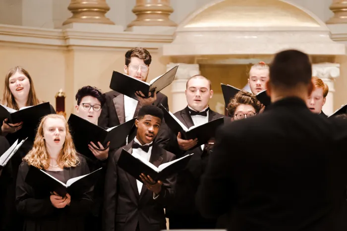 Choir members singing