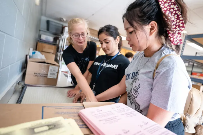 Female students sorting books