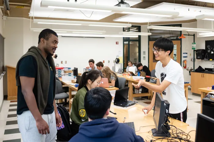 Students speaking while working on a class project