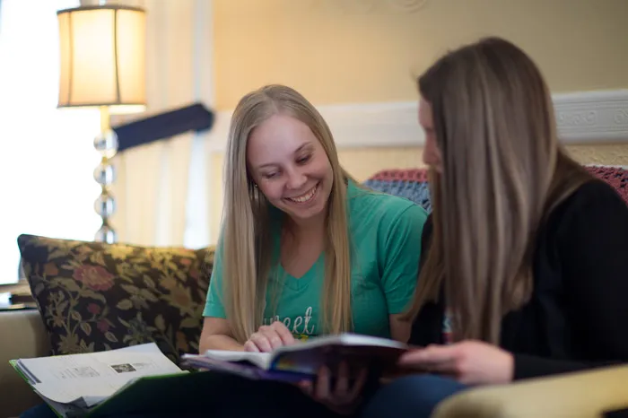 Two femail students studying in Fayerweather Hall