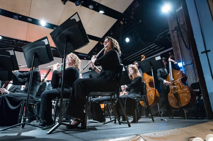 Students performing during band concert at Peoples Bank Theatre