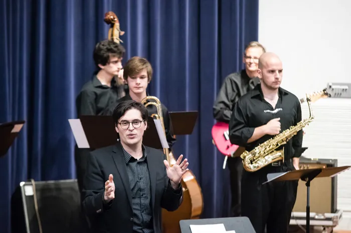 Instructor Jordan Reed leading the Jazz Combo during a concert