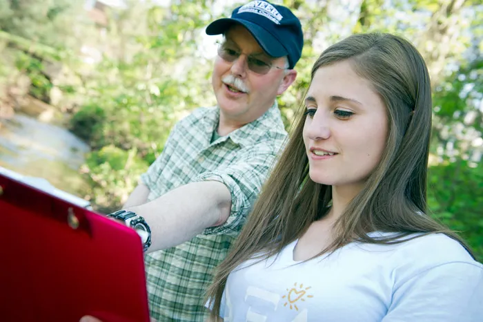 Dave McShaffrey working with a student in the field