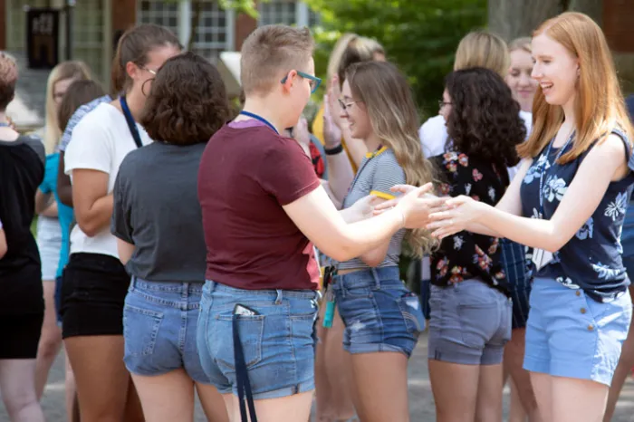 Female students participating in an icebreaker at the first WISE