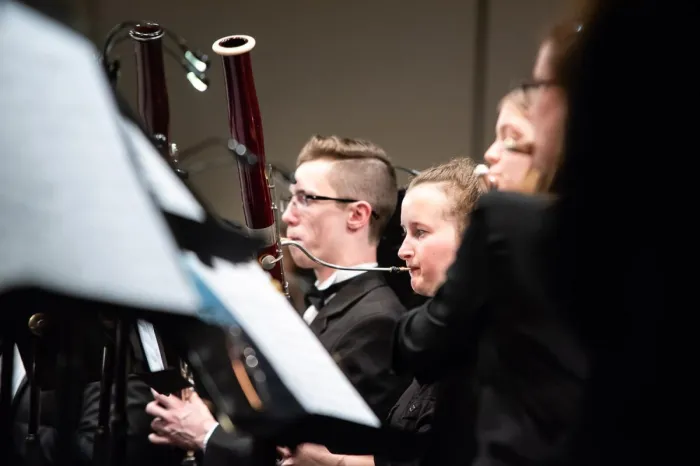 Students performing with wind instruments