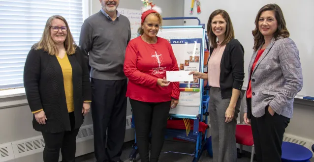 Cynthia Brown, Fred Rader, Emily Buck, Amanda Rider and Amy Nahley during a Parkersburg Community Foundation Grant check passing ceremony