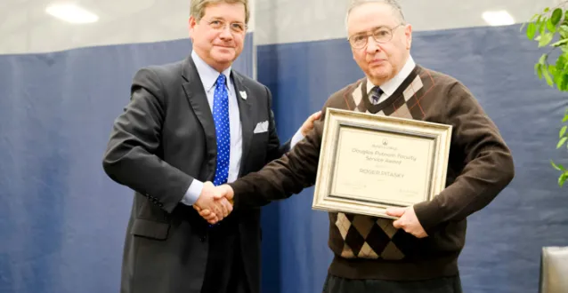 President Ruud congratulating Dr. Roger Pitasky