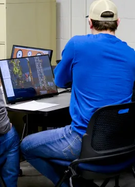 An Energy Systems Studies minor interacts with a drill simulator during class