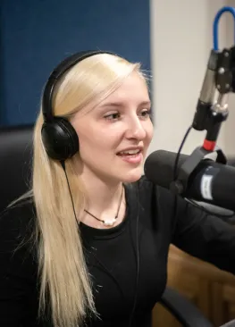 A Marietta College student majoring in Journalism/Broadcasting records in a studio