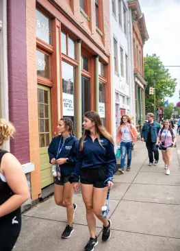 Marietta College students walking down the sidewalk on Front Street