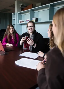 A Marietta College Organizational Communication and Public Relations majors speaks with a professor.