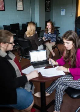 A Marietta College Organizational Communication and Public Relations majors work during class.